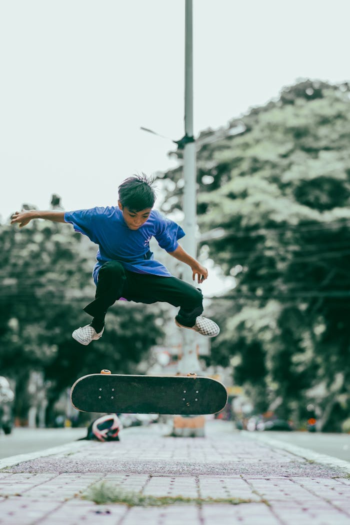 youthful-skater-mid-flip-in-urban-environment-33922998